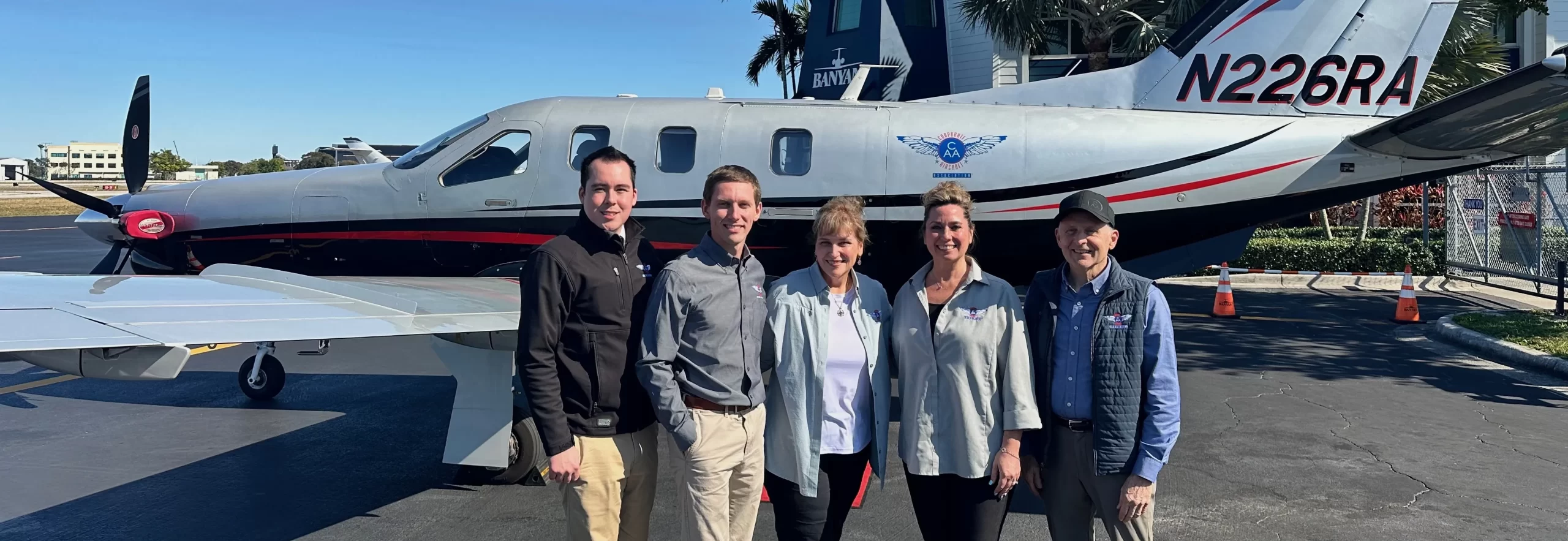 CAA leadership team in front of the CAA TBM
